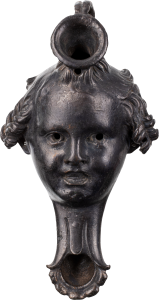 Oil Lamp in the Form of an Eros Head, Front View, Bronze, Roman Imperial Period, 1st–3rd cent. CE, RHM Collection.
